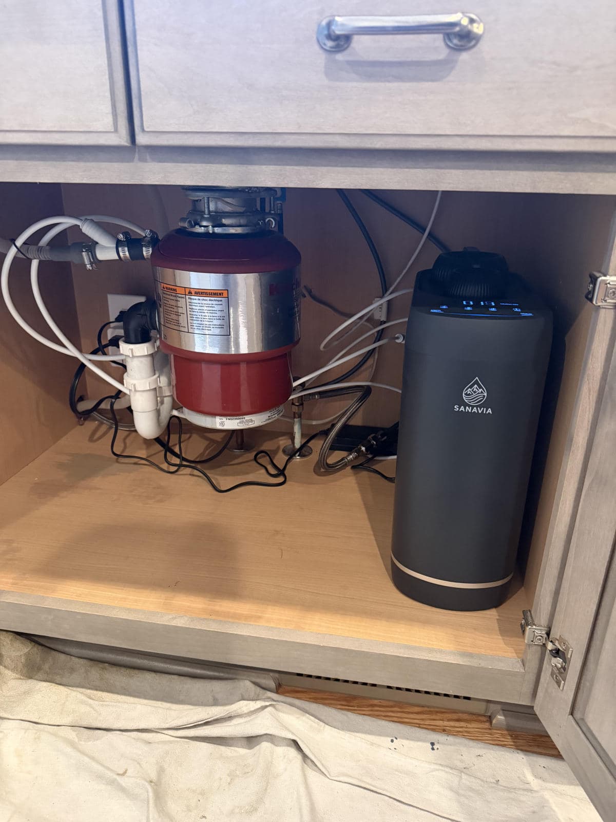 The Hydra installed under a kitchen sink beside the garbage disposal